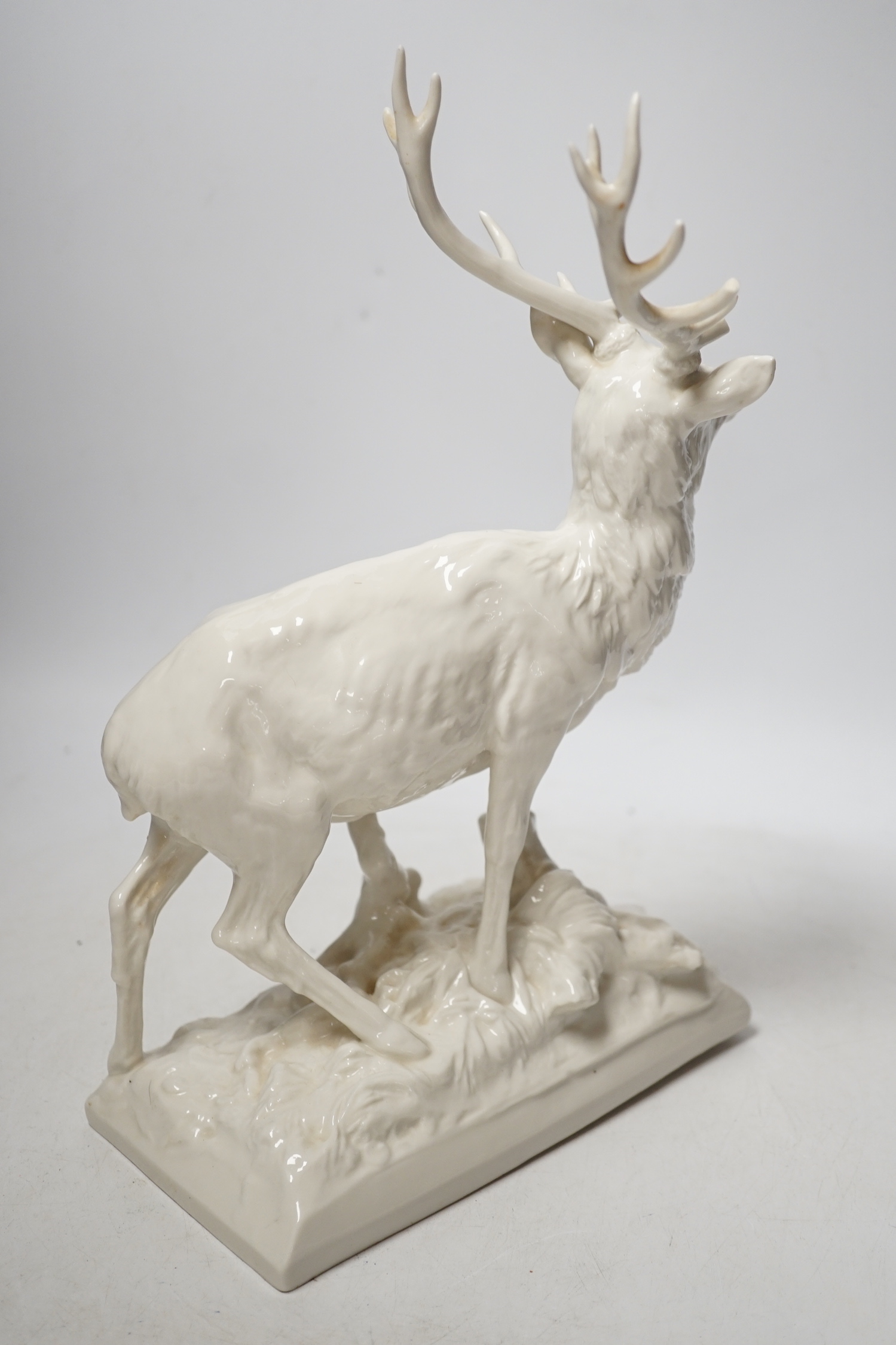 A Nymphenburg white glazed porcelain model of a stag, 31cm high